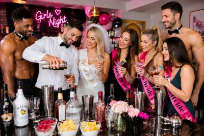 Butler in the Buff serving drinks to hens at a hen party