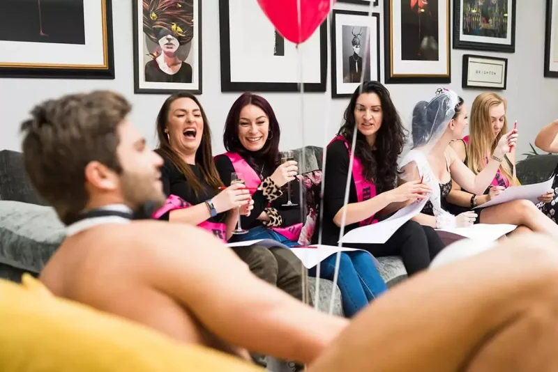 Close-up of model posing nude for hen party art class